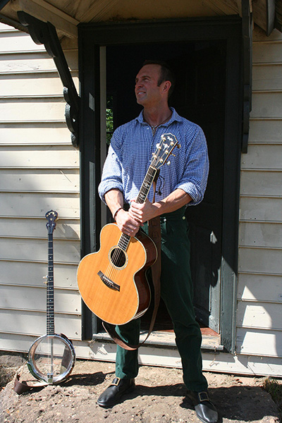 Charlie with Taylor guitar and banjo